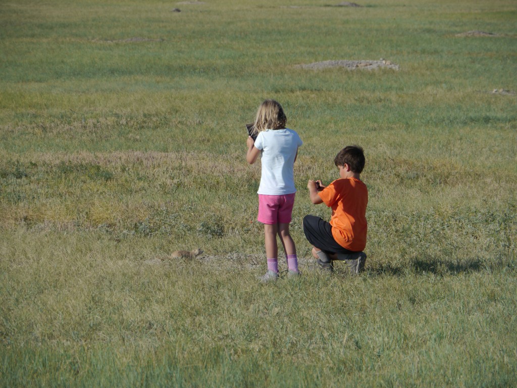 Kat using DS and Kane using Sony Bloggie to capture prairie dog in Badlands, South Dakota.