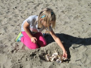 Kat collecting crab shells and putting them into a pile