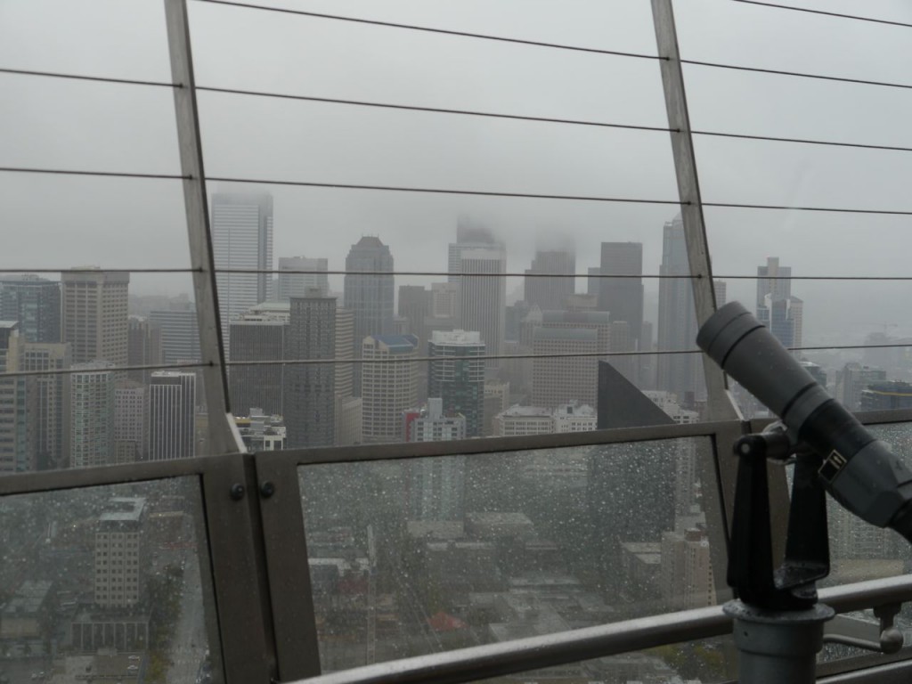 Cool to see the city from the Needle, even if visibility was limited.  I'm pretty sure the tan concrete hotel on the left is the "Red Lion", where I shared the presidential suite with a dude in July 2011. (story for another day)