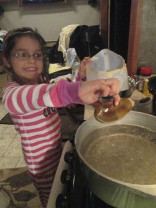 Kat getting ready to drop the clam into the boiling water. 