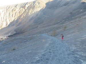 Kane hiking down into the crater. 