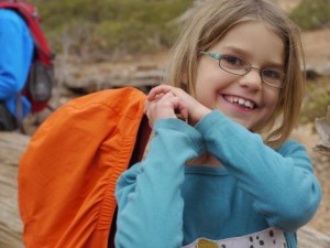 Such a sweet sister!  Kat is carrying Kane's coat.  