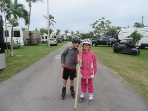 Kane helping Kat rollerblade.  