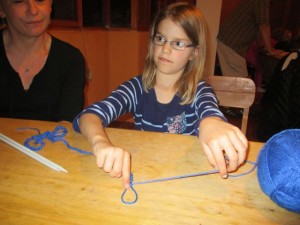 Raisa and Zadie teaching Kat to finger knit.  Hope to be pros time with come home! 