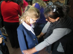 Kat trying on her jacket for her uniform. 