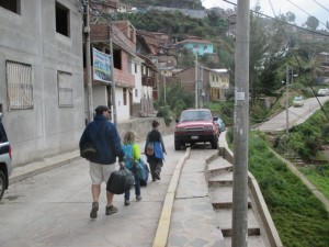 Walking down our street to catch a taxi to the airport. 